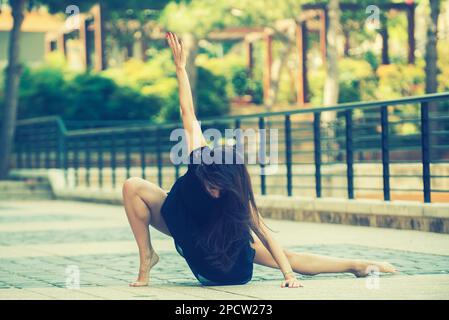 Barefooted ballet dancer dancing in the street Stock Photo