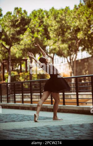 Barefooted ballet dancer dancing in the street Stock Photo