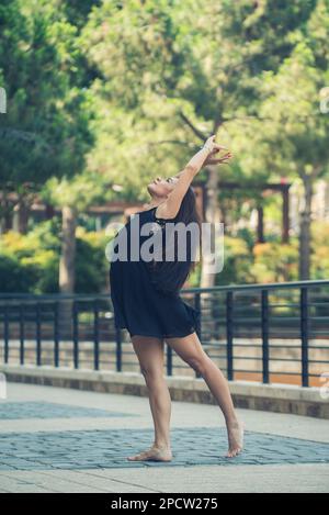 Barefooted ballet dancer dancing in the street Stock Photo