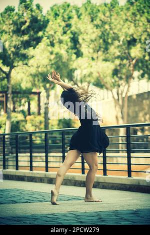 Barefooted ballet dancer dancing in the street Stock Photo