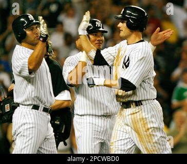 New York Yankees on-deck batter Erik Kratz (38) celebrates with teammate  Thairo Estrada, right, after Estrada hit a solo home run during the fourth  inning of a baseball game, Monday, Aug. 17