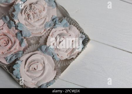 Homemade marshmallows in a cardboard box. Zephyr flowers. Gift wrap. Stock Photo