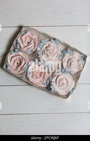 Homemade marshmallows in a cardboard box. Zephyr flowers. Gift wrap. Stock Photo