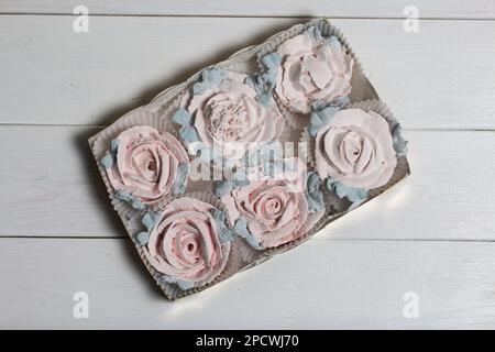 Homemade marshmallows in a cardboard box. Zephyr flowers. Gift wrap. Stock Photo