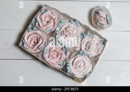 Homemade marshmallows in a cardboard box. Zephyr flowers. Gift wrap. Stock Photo