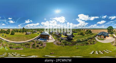 360 degree panoramic view of aerial full seamless spherical hdri 360 panorama view above green village with private development sector with country houses in equirectangular proje