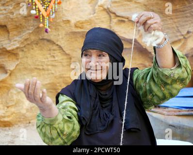 Old Bedouin woman in Petra Jordan Stock Photo