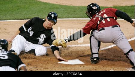 Chicago White Sox Joe Crede follows through on a RBI single scoring Aaron  Rowand against the Houston Astros during the second inning of game 2 of the  World Series at U. S.