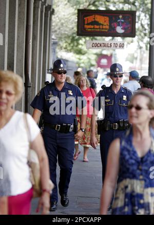 Louisiana State troopers Ross McCain left and Patrick Bell walk a