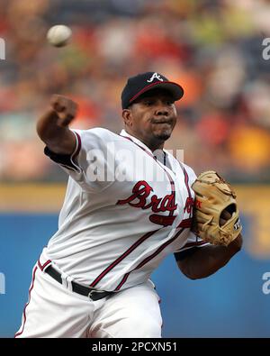 Atlanta Braves' starting pitcher Jorge Sosa, left, walks back to