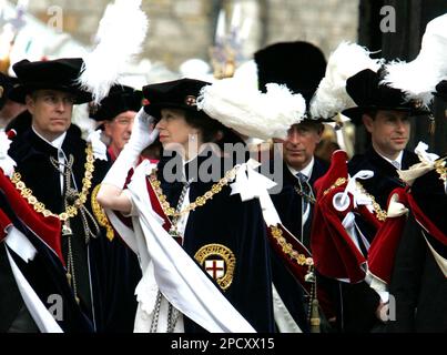 Britain's Princess Anne holds on to her hat as she arrives at St George's Chapel in Windsor, England. Monday June 19, 2006, for the annual Garter Service where Prince Andrew, left, and Prince Edward, right, were formally made Knights of the Garter. Second from right is Prince Charles. The Order of the Garter, established by Edward III in 1348, is the Queen's personal gift, and is given without advice from government ministers.(AP Photo/Tim Ockenden, pool)