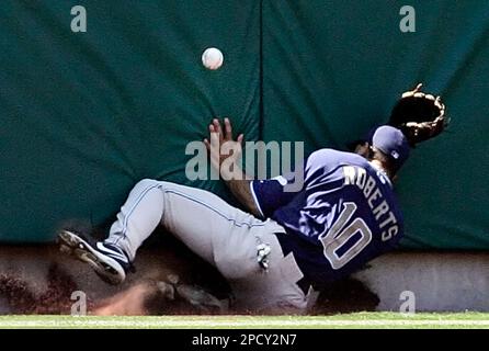 San Diego Padres left fielder Dave Roberts crashes into the