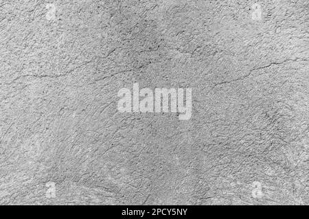 Concrete cracked rough wall background closeup Stock Photo