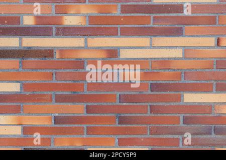 Brick wall urban background with brown and red elements Stock Photo