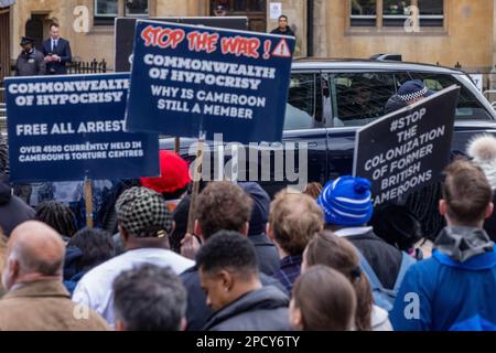 London, UK. 13th March, 2023. The arrival of the Prince and Princess of Wales for a Commonwealth Day service at Westminster Abbey is viewed from behind human rights activists protesting Cameroon's membership of the Commonwealth. Credit: Mark Kerrison/Alamy Live News Stock Photo