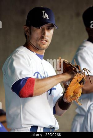 Five-time All-Star Nomar Garciaparra, right, holds his new Los