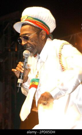 ** FILE ** Bunny Wailer sings songs of Bob Marley at the One Love concert to celebrate Marley's 60th birthday, in this Feb. 6, 2005, file photo in Kingston, Jamaica. Wailer, the reggae legend who was one of the original Wailers along with Bob Marley and Peter Tosh, will tour for the first time with a new generation of Marleys. Wailer will play alongside Marley's sons, Stephen and Ziggy, on the Roots, Rock, Reggae Festival, a month-long tour that opens Aug. 6, 2006 in Redway, Calif., after a year hiatus. (AP Photo/Collin Reid ) **EFE OUT**