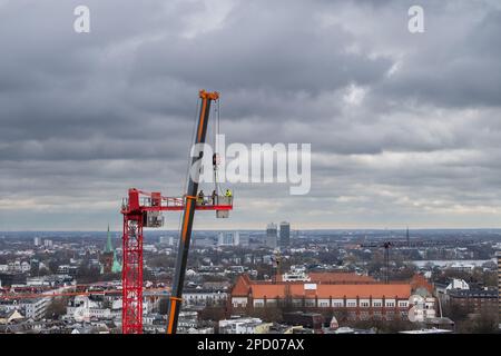 Assembling a construction crane in Hamburg, Germany. Stock Photo