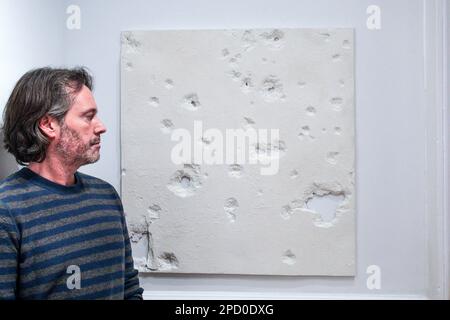 London, UK. 14th Mar, 2023. Alderney: The Holocaust in British Soil exhibition.  Part of the execution wall that Piers has moulded from part of the original one in the island, 15 March 2023 at Cromwell Place, London until 15 April. Credit: Paul Quezada-Neiman/Alamy Live News Stock Photo