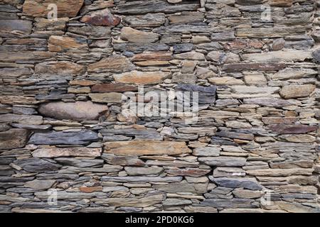 Retro stone wall texture. Natural stone wall background. Stock Photo