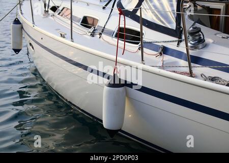 Sailing in Dubrovnik, Croatia. Sailing yacht fenders on port side. Inflatable fender buoys. Stock Photo