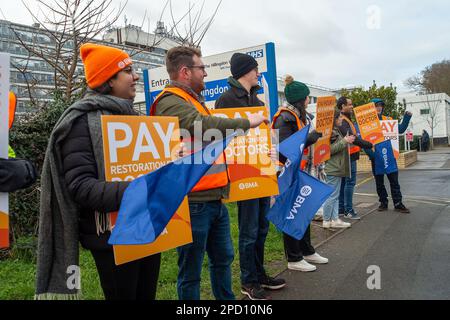 Hillingdon, Middlesex, UK. 14th March, 2023. Junior Doctors picketing outside Hillingdon Hospital in West London on day two of the Junior Doctors 72 hour strike over pay, pensions and working conditions. Many motorists passing the picket line were tooting their horns in support of the doctors. Credit: Maureen McLean/Alamy Live News Stock Photo