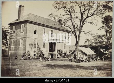 Bolling house originally named "Mitchell's" (later "Bull Hill"), possibly located in Hopewell, Virginia. Title devised by library staff, Caption continues: It stood in the present day "Mansion Hills" subdivision of Hopewell, Virginia on the south bank of the Appomattox River between Petersburg and City Point. It burned in 1925 and was later torn down. At the time of this photo, it was owned by the Bland family. Nearby Broadway Landing was used to land cattle during the siege of Petersburg. The house was shelled by Federal gunboats. Information about this house is filed in Reference File under Stock Photo