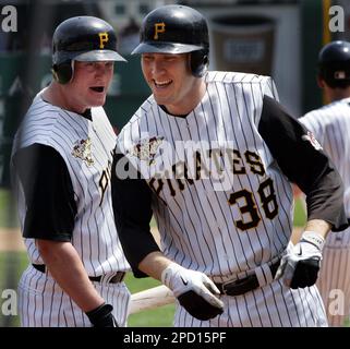 Pittsburgh Pirates' Jason Bay trots around third to greetings from