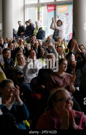 Berlin, Germany. 14th Mar, 2023. Participants of a strike meeting clap after a speech at an event during warning strikes at hospitals in Berlin. Credit: Carsten Koall/dpa/Alamy Live News Stock Photo