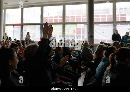 Berlin, Germany. 14th Mar, 2023. Participants in a strike meeting clap at an event during warning strikes at hospitals in Berlin. Credit: Carsten Koall/dpa/Alamy Live News Stock Photo