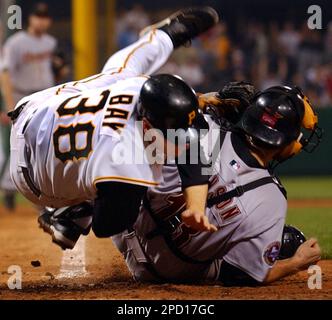 Pittsburgh Pirates' Jason Bay (38) is congratulated by Jack Wilson
