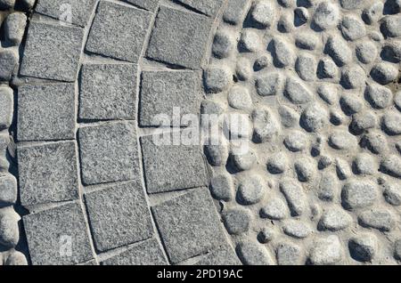 Stone walkway paved with stone and granite, round and square Stock Photo