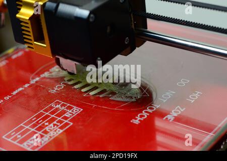 3D printer prints red form Stock Photo