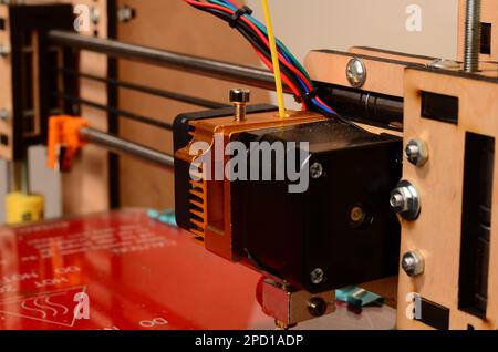 3D printer prints red form Stock Photo