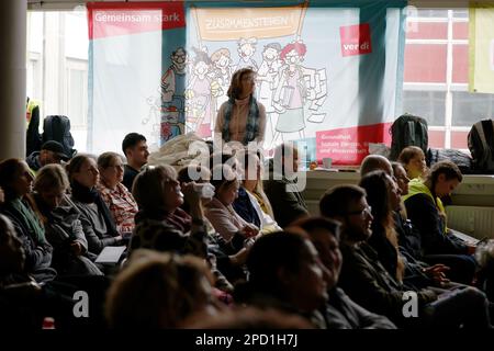 Berlin, Germany. 14th Mar, 2023. Participants of a strike meeting follow a speech at an event during warning strikes at hospitals in Berlin. Credit: Carsten Koall/dpa/Alamy Live News Stock Photo