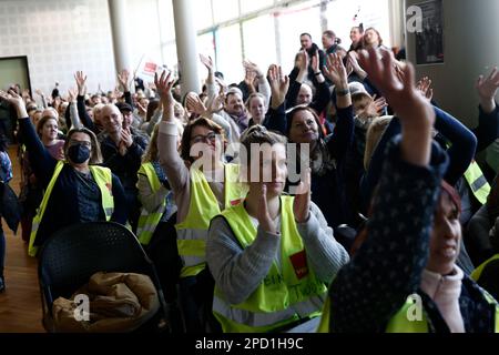 Berlin, Germany. 14th Mar, 2023. Participants in a strike meeting clap at an event during warning strikes at hospitals in Berlin. Credit: Carsten Koall/dpa/Alamy Live News Stock Photo