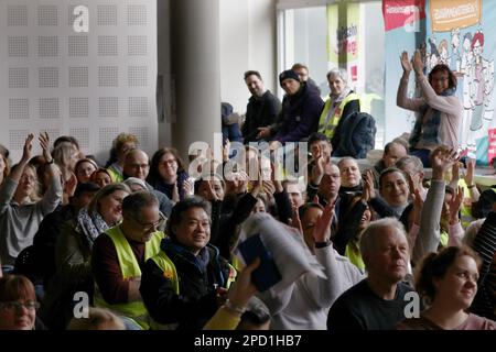 Berlin, Germany. 14th Mar, 2023. Participants in a strike meeting clap at an event during warning strikes at hospitals in Berlin. Credit: Carsten Koall/dpa/Alamy Live News Stock Photo