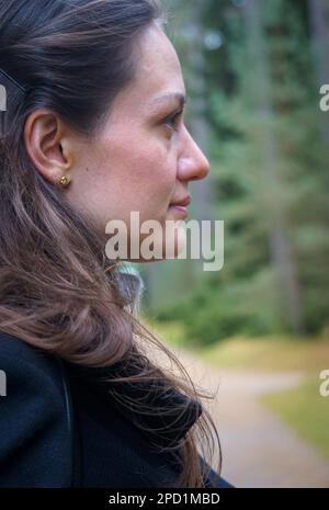 Side view of thoughtful young woman looking away Stock Photo
