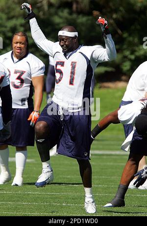 Denver Broncos linebacker Keith Burns jokes with teammates as the team  stretches before taking part in their first football practice following a  bye week for the Broncos in Denver on Monday, Oct.