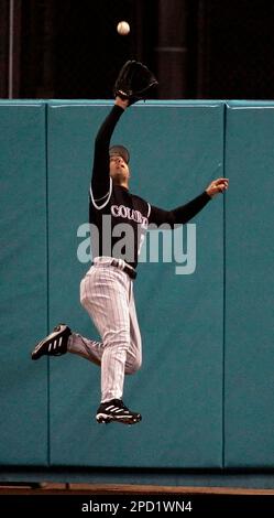 Colorado Rockies center fielder Cory Sullivan makes a leaping catch at the wall of a fly ball hit by Los Angeles Dodgers' Jeff Kent in the eighth inning of a baseball game in Los Angeles on Monday, May 22, 2006. The Dodgers won 6-1.(AP Photo/Francis Specker)