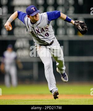 Morgan Ensberg of the Houston Astros attempts to field a groud