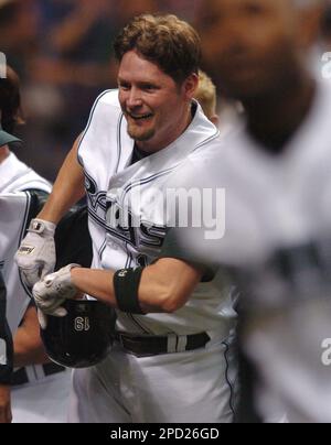Tampa Bay Devil Rays' Aubrey Huff, left is congratulated by