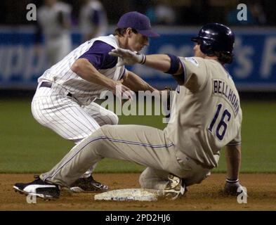 San Diego Padres' Mark Bellhorn is greeted at the dugout after his