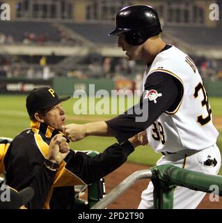 Pittsburgh Pirates' Jason Bay trots around third to greetings from