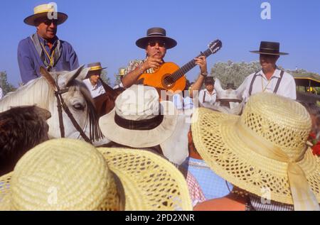 pilgrims singing near Doñana Palace,Romeria del Rocio, pilgrims on their way through the Doñana National Park,  pilgrimage of Sanlúcar de Barrameda br Stock Photo