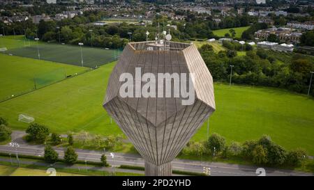 Dublin / Ireland : Aerial view of UCD water tower in shape of dodecahedron or precisely - pyritohedron. Example of Irish brutalist architecture Stock Photo