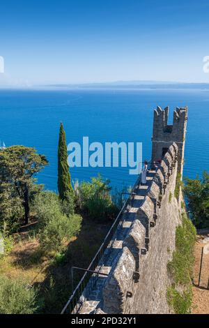 Medieval stone wall ending with turret facing the sea, medieval fortification in coastal town of Piran, Slovenia. Stock Photo