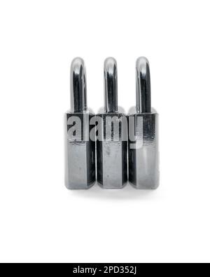 Three steel padlocks side by side, isolated on white background, side view Stock Photo