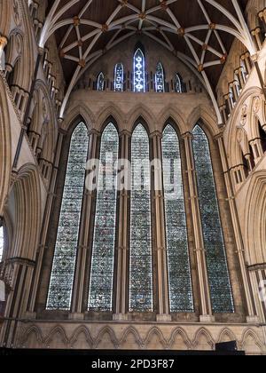 One of the magnificent stained glass windows seen from inside York Minster Stock Photo