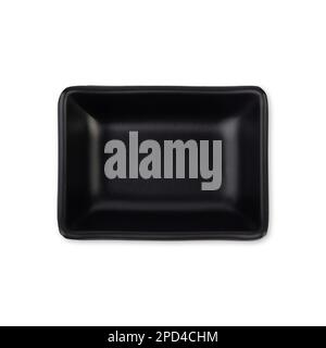 Small black ceramic plate isolated over white background. Stock Photo